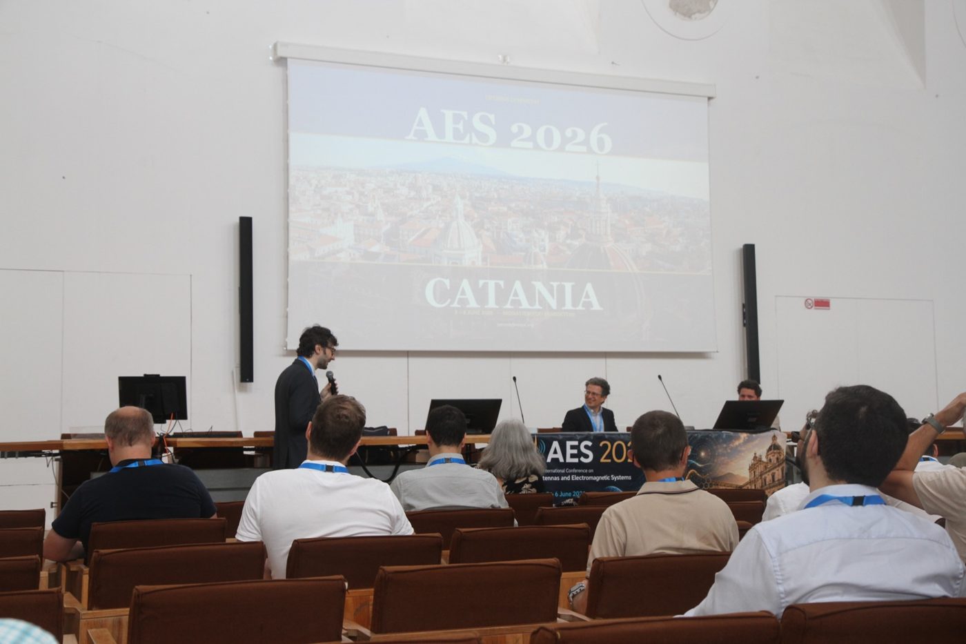 Opening session of AES 2026 in Catania, with 'AES 2026 Catania' on the main screen